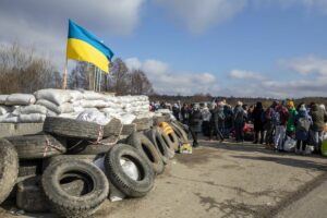 UKRAINIAN COUNTRYSIDE IN NORTH LWIV CHECKPOINT FOR THE ARRIVAL OF BUSES FOR CIVILIANS RUNNING TO...