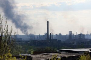 DONETSK REGION, UKRAINE – MAY 4, 2022: Fire at the Azovstal iron and steel plant after shelling in...
