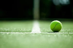 depositphotos_78527378-stock-photo-tennis-ball-on-tennis-grass.jpg