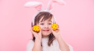 8790732_20103255_portrait_little_girl_with_bunny_ears_w_easter_eggs.jpg