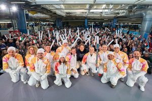 La Fiamma Olimpica arriva a Mirafiori: Elkann esalta il rinnovato spirito dei Giochi.