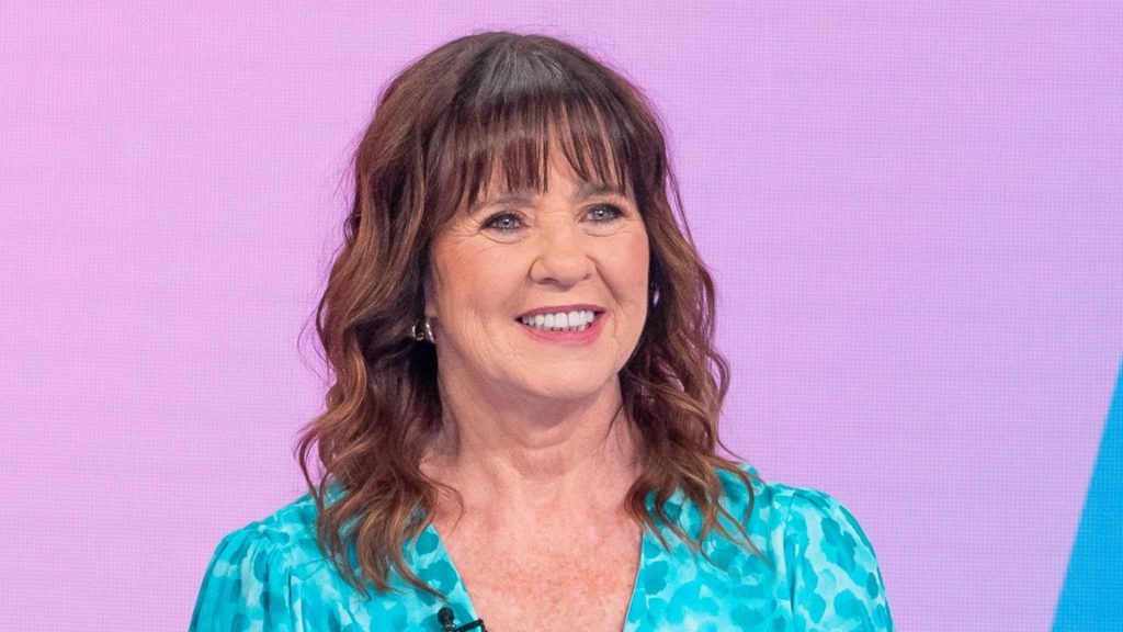 Coleen Nolan’s wrap leopard print dress features flowing sleeves for a stunning, flattering look.