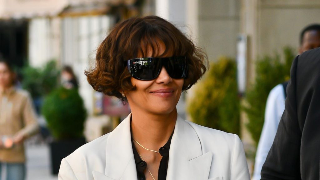 Halle Berry’s rainy day style: jeans, blazer, and Adidas Sambas perfect for unpredictable summer weather.
