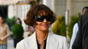 Halle Berry’s rainy day style: jeans, blazer, and Adidas Sambas perfect for unpredictable summer weather.