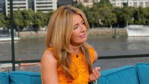 Cat Deeley’s vibrant orange M&S dress: a stunning choice for petite figures!