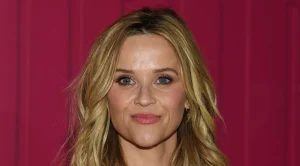 Reese Witherspoon’s chic white dress and cowboy boots for a stylish transition to fall.