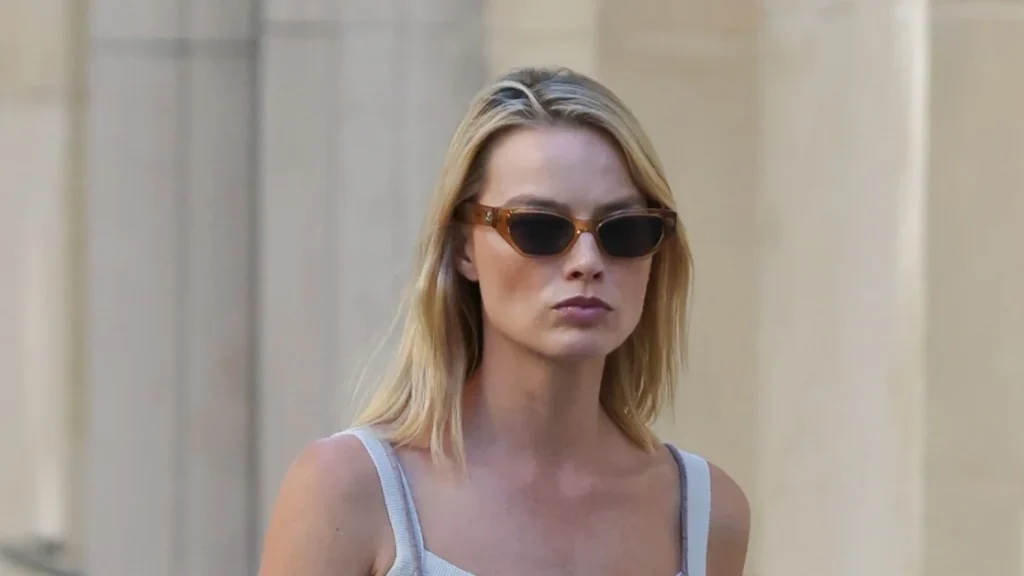 Margot Robbie rocks dungarees and slides for a perfect late summer look