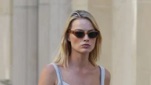 Margot Robbie rocks dungarees and slides for a perfect late summer look