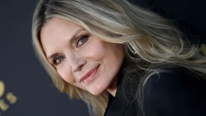 Michelle Pfeiffer stuns in berry velvet co-ord for timeless chic look.