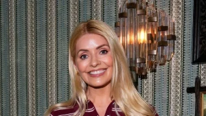 Holly Willoughby styles classic white shirt and jeans with chic autumn ballet flats.