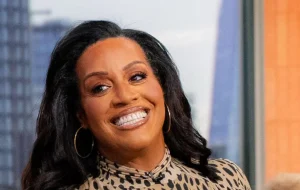 Alison Hammond elevates her style with a chic croc-embossed skirt paired with Rixo animal print top